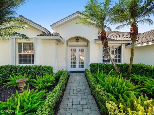 property entrance featuring french doors