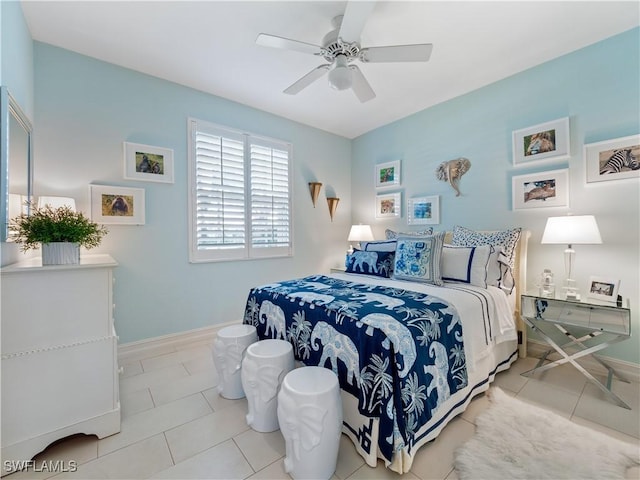 bedroom with ceiling fan and light tile patterned floors