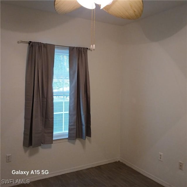 empty room featuring dark wood-type flooring