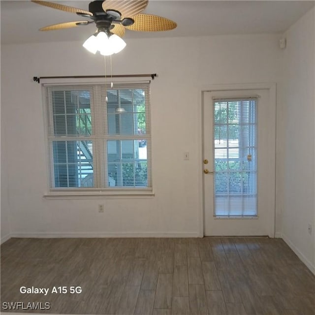 interior space featuring ceiling fan and dark hardwood / wood-style flooring