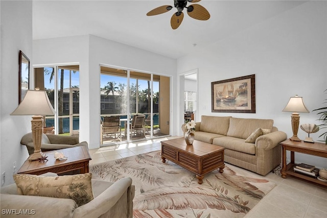 tiled living room featuring ceiling fan