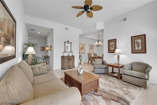 living room with light tile patterned floors and ceiling fan with notable chandelier