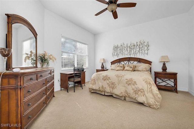 bedroom featuring ceiling fan, light colored carpet, and lofted ceiling