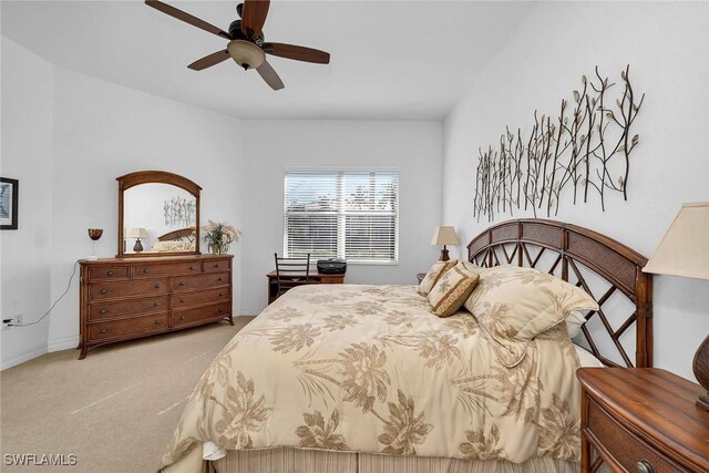 bedroom featuring ceiling fan and light carpet