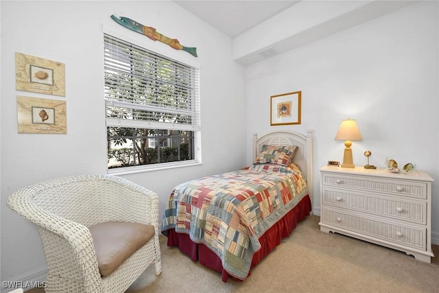 bedroom featuring light colored carpet