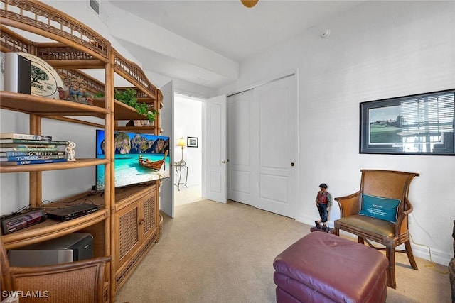 living area with light colored carpet