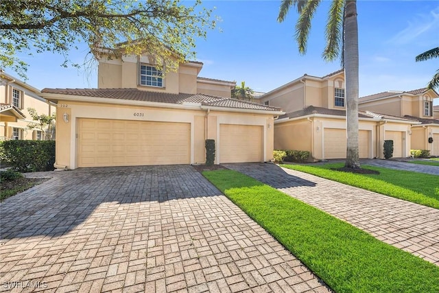 mediterranean / spanish-style house featuring a garage