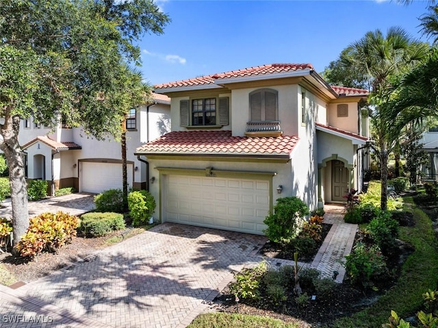 mediterranean / spanish-style home featuring a garage