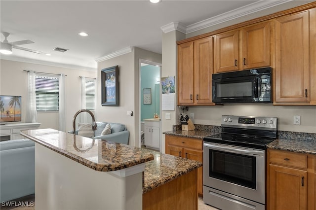 kitchen with a kitchen island, ornamental molding, dark stone counters, and stainless steel electric range