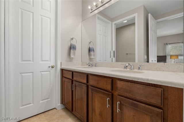 bathroom with tile patterned flooring and vanity