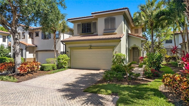 mediterranean / spanish house featuring a garage