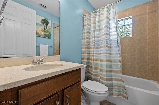 full bathroom with toilet, vanity, and shower / bath combo with shower curtain