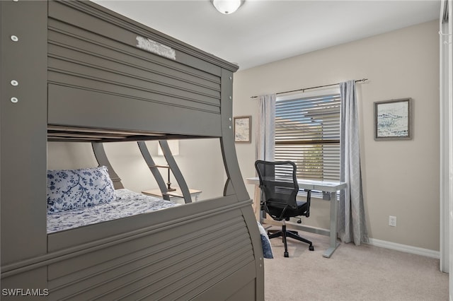 bedroom with light colored carpet