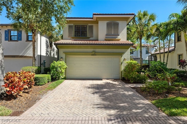 mediterranean / spanish-style home featuring a garage