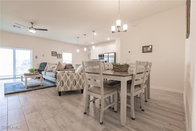 dining room with ceiling fan with notable chandelier, recessed lighting, visible vents, and baseboards