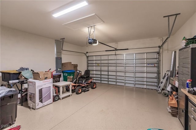 garage featuring a garage door opener