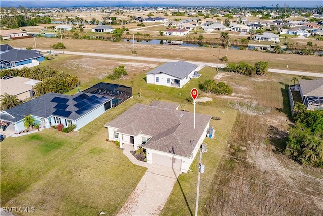 aerial view featuring a water view and a residential view