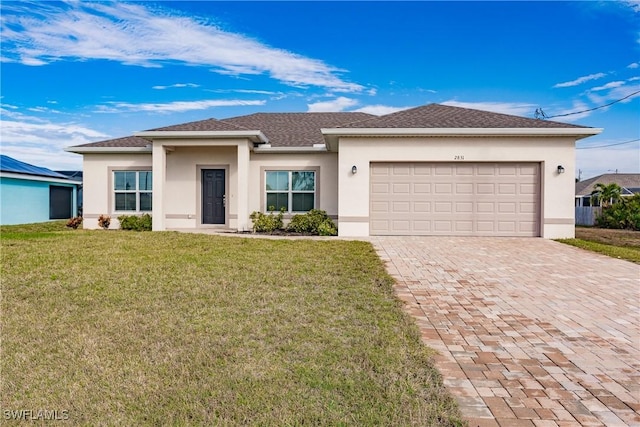 view of front of property with a front lawn, decorative driveway, and stucco siding