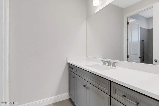 bathroom with tile patterned flooring and vanity