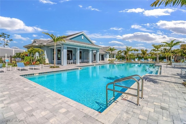 view of swimming pool with a patio area