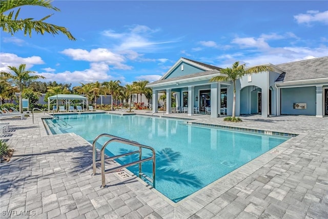 view of swimming pool featuring a patio area