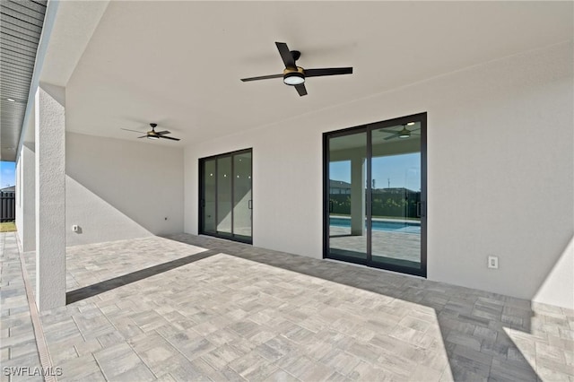 view of patio / terrace featuring ceiling fan