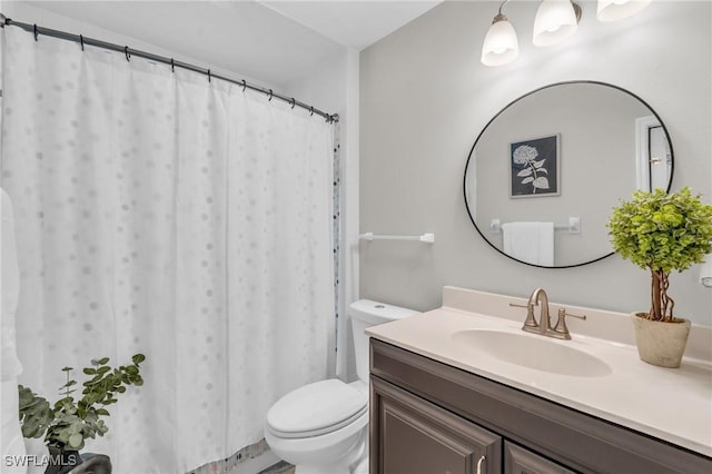 full bathroom with toilet and vanity