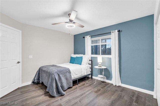 bedroom with ceiling fan and hardwood / wood-style floors