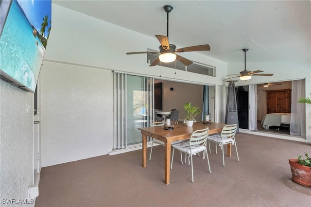 dining room featuring ceiling fan and vaulted ceiling