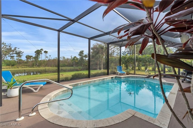 view of pool featuring a water view, glass enclosure, and a patio area