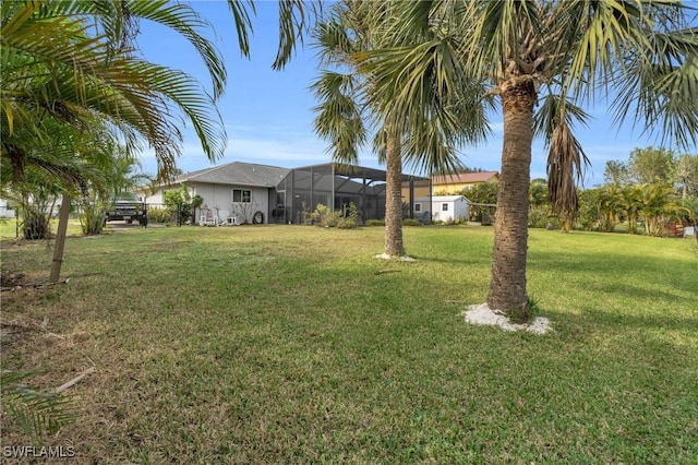 view of yard featuring a lanai