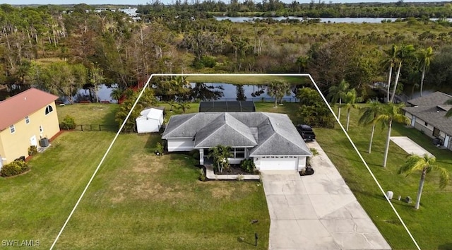 aerial view with a forest view and a water view