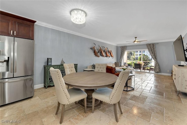 dining space with ceiling fan with notable chandelier and ornamental molding