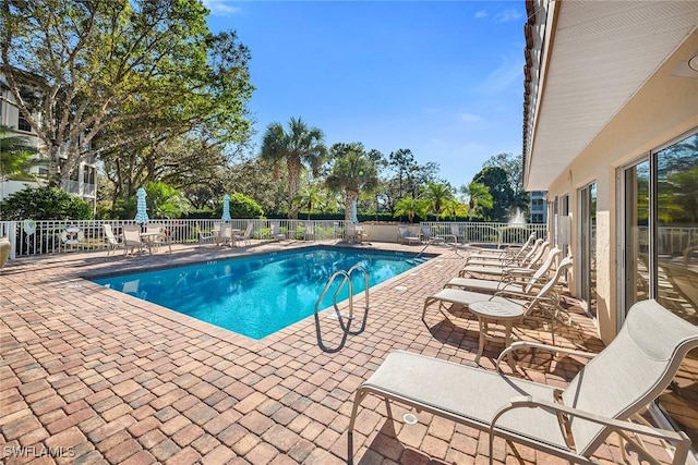 view of swimming pool featuring a patio area