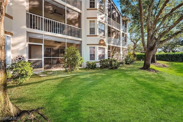 exterior space featuring ceiling fan