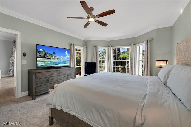 bedroom featuring light colored carpet, ceiling fan, and ornamental molding