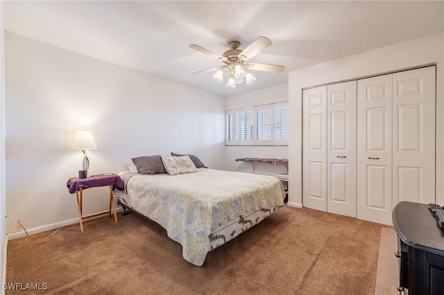 carpeted bedroom featuring a closet, a ceiling fan, and baseboards