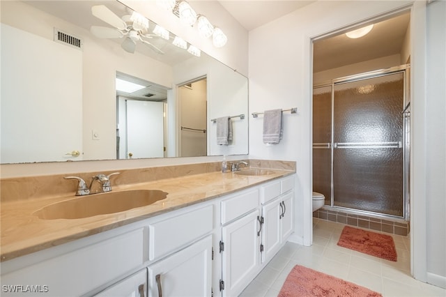 full bathroom with a stall shower, visible vents, a sink, and tile patterned floors