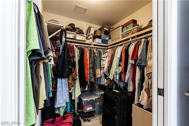 walk in closet featuring visible vents