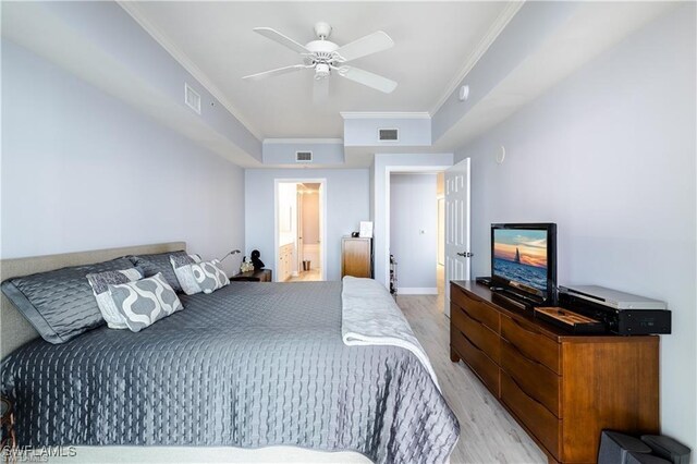 bedroom featuring connected bathroom, crown molding, ceiling fan, and light hardwood / wood-style floors