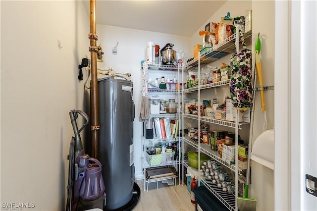 storage area featuring electric water heater