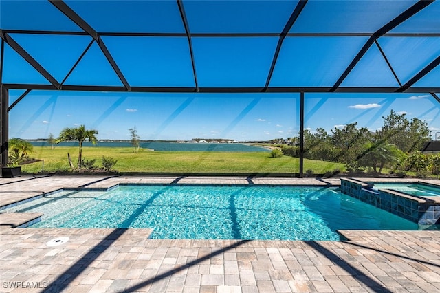 view of swimming pool with a lanai, a patio area, and an in ground hot tub