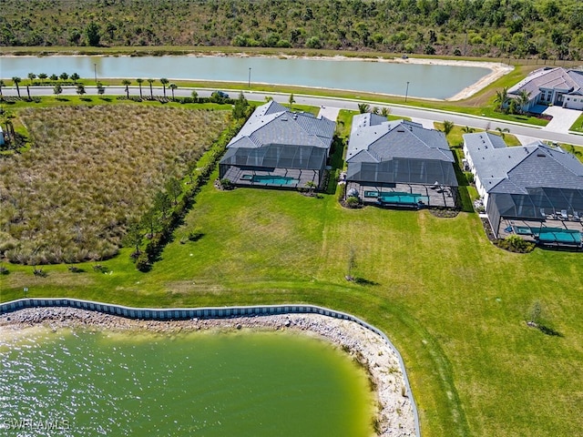 bird's eye view featuring a residential view and a water view