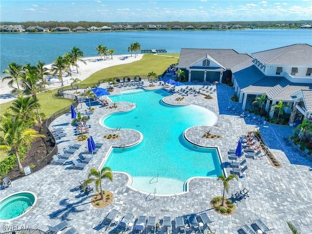 view of swimming pool with a water view