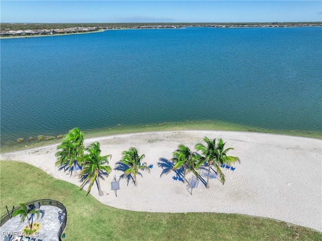 bird's eye view featuring a water view and a view of the beach