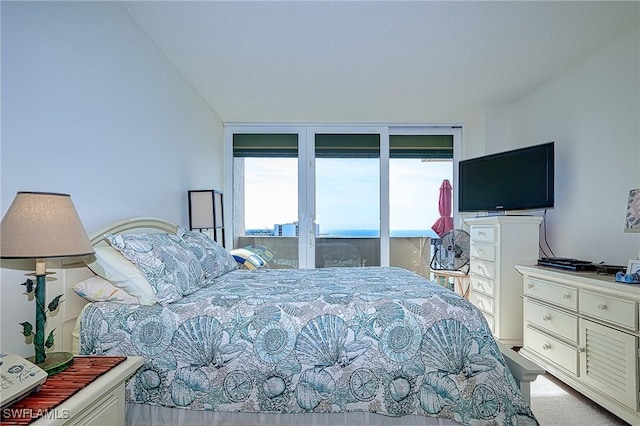 bedroom featuring a wall of windows