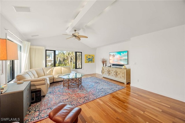 living room featuring wood-type flooring, lofted ceiling with beams, and ceiling fan