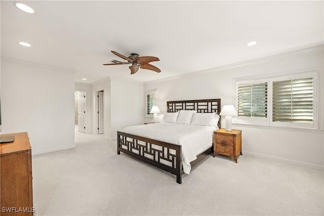 bedroom with ceiling fan, light colored carpet, and ornamental molding