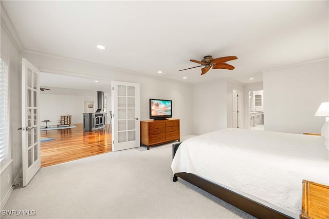 bedroom featuring french doors, ceiling fan, and crown molding