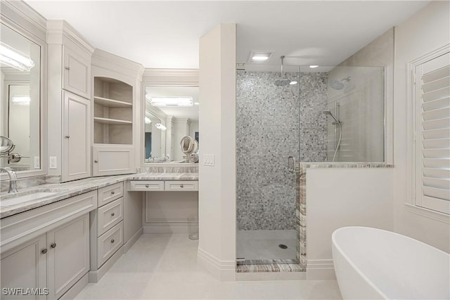 bathroom with vanity and independent shower and bath